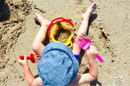 child playing with sand, shovel, bucketの写真素材