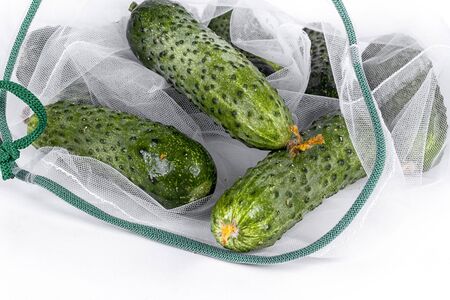 Zero waste shopping textile bag with farm fresh organic vegetable. Plastic free. Reusable, recycled, homemade produce bag for fruit. Eco friendly concept.の写真素材