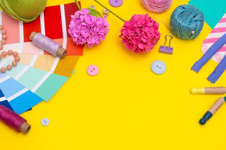 Sewing tools and equipment on yellowの写真素材