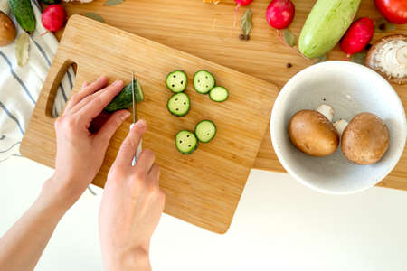 Healthy nutrition salad preparing concept. Various vegetables on the kitchen table.