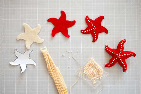 DIY instruction. Step by step tutorial. Making Summer decor - wreath of rope with sea stars made of felt. Craft tools and supplies. Step 3.の写真素材