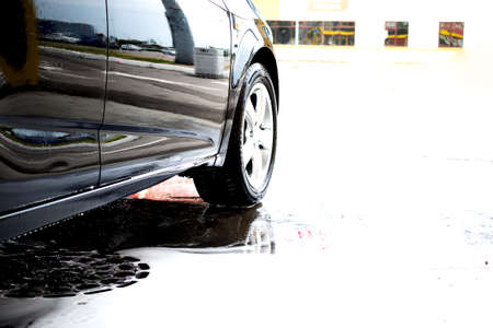 Car washing banner copy space. Cleaning car using high pressure water. Contactless self-service car...