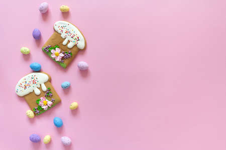 Easter poster and banner template with Easter cakes and colored eggs on pink background.Greetings and presents for Easter Day in flat lay styling.Promotion and shopping template for Easterの写真素材