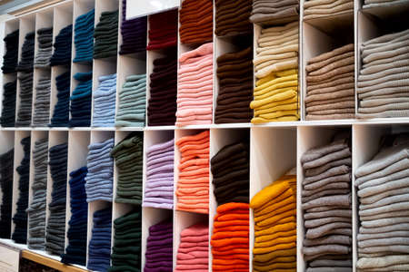 Multicolored bright socks on shelve in storeの写真素材
