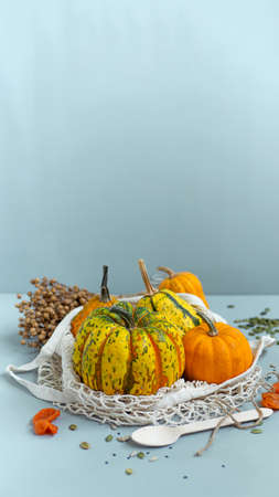 Zero waste healthy food pumpkin, seeds, vegetables, dried fruits close up on blue background. Groceries in textile bags,glass jars. Eco friendly plastic free low waste lifestyle.の写真素材