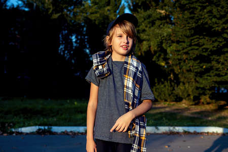 Teenger blonde boy outdoor park lifestyle portrait