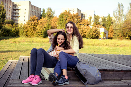 Mom and daughter spend time together in parkの写真素材