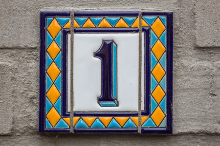 House number one . Blue lettering on a white plate. Ceramicsの写真素材