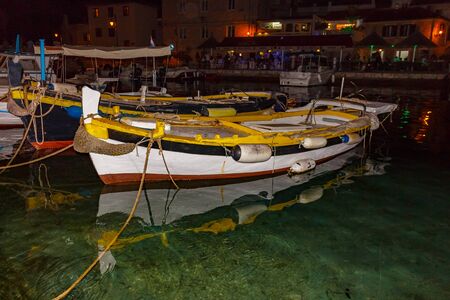 Small wooden fishing boats in marine.の写真素材
