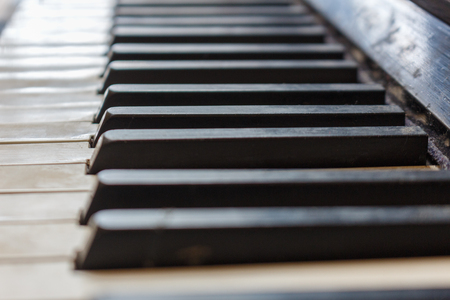 Closeup of old piano keyboard shallow focusの写真素材