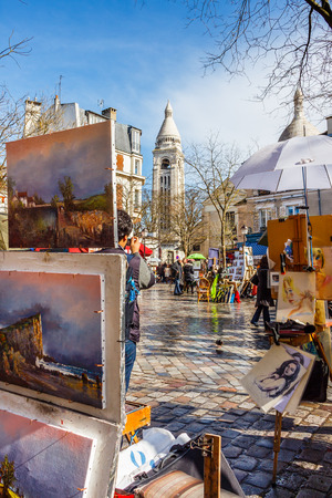 PARIS, FRANCE - MARCH 04, 2015: Artists easels and artwork set up in Place du Tertre in Montmartre. Montmartre attracted many famous modern painters in the early 20th century.のeditorial素材
