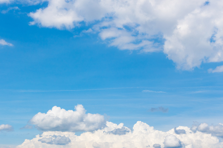 Blue sky with white clouds backgroundの写真素材