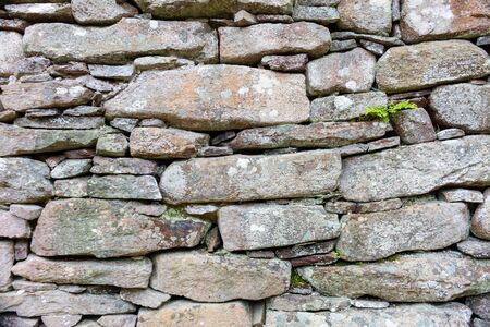 Part of a old stone wall, for background or texture.の写真素材
