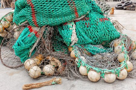 old fishing net on the shore green color