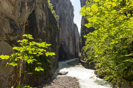 View of river Aare near the town of Meiringen, in the Bernese Oberland region of Switzerland.の写真素材