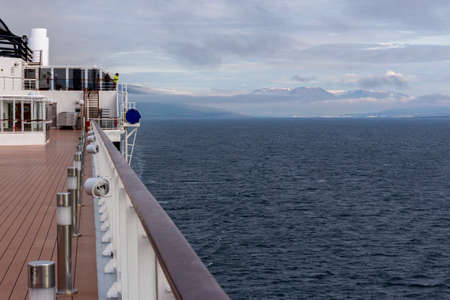 Part of the big cruise ship as a background. Blue ocean with waves.の写真素材