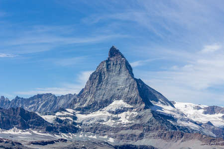 Matterhorn Mountain with white snow and blue sky in summer in Switzerlandの写真素材