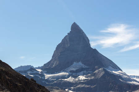 Matterhorn Mountain with white snow and blue sky in summer in Switzerlandの写真素材