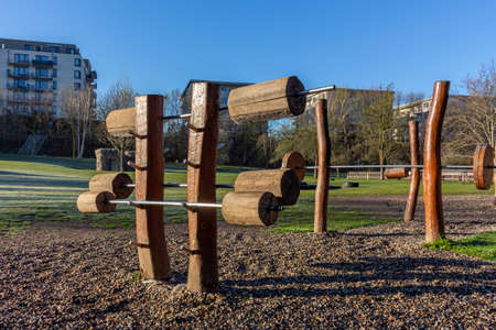 Outdoor gym in public park wooden barbbells