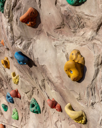 A climbing bouldering rock wall with grip for hands and feetの写真素材