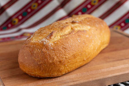 fresh white bread  on brown wood cutting boardの写真素材