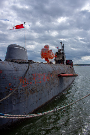 Soviet submarine U461 with red flag in PeenemÃ¼nde harbor, Germanyの写真素材