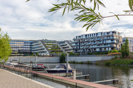 modern architecture residential building condominium appartments development cloud with small boat marinaの写真素材
