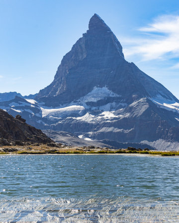 Matterhorn Mountain with white snow and blue sky in summer in Switzerlandの写真素材