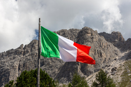 Italy flag on wind mountain backgroundの写真素材