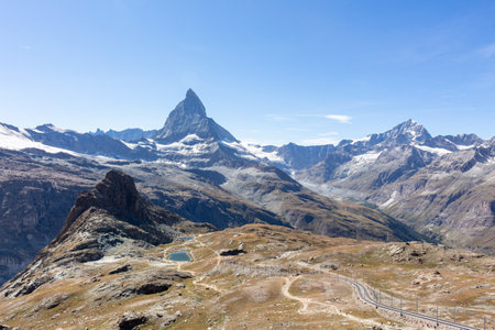 Matterhorn Mountain with white snow and blue sky in summer in Switzerlandの写真素材