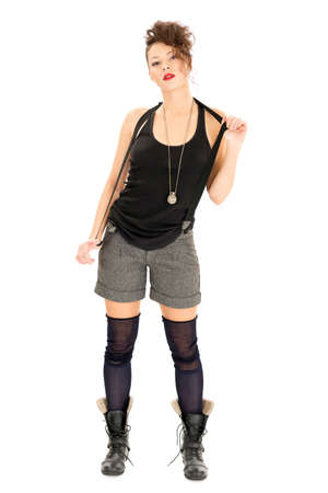 Beautiful woman in shorts and military boots isolated on whiteの写真素材