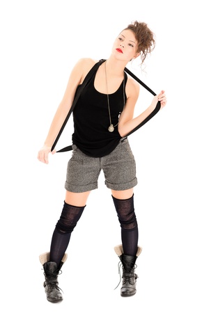 Serious woman in military boots, shorts isolated on whiteの写真素材