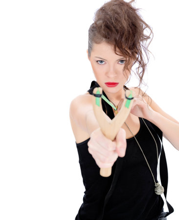 Young woman with slingshot isolated on whiteの写真素材