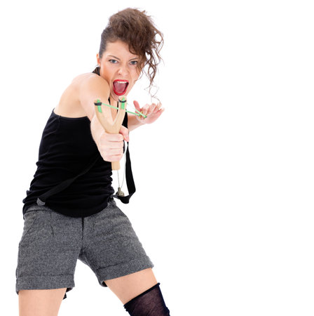 Young woman with slingshot isolated on whiteの写真素材