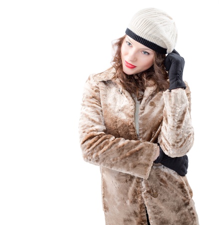 Beautiful young woman in a coat  on white backgroundの写真素材