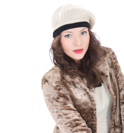 Beautiful young woman in a coat  on white backgroundの写真素材