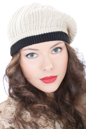 Beautiful young woman in a coat  on white backgroundの写真素材