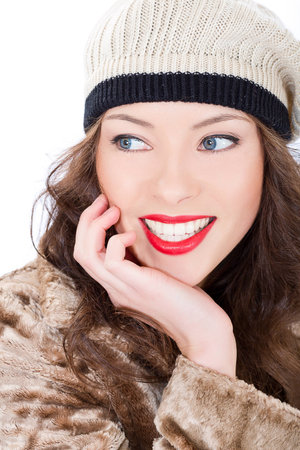 Beautiful smiling young woman in a coat  on white backgroundの写真素材