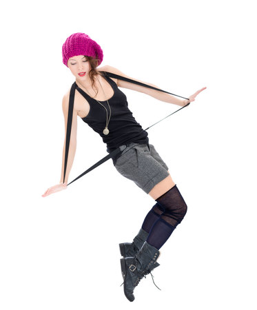 Funny young woman in military boots and pink hat on white backgroundの写真素材