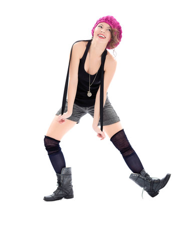 Funny young woman in military boots and pink hat on white backgroundの写真素材