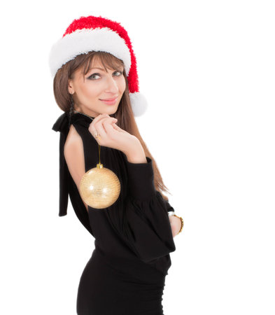 Beautiful smiling christmas santa woman with snow ballの写真素材