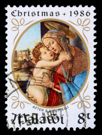 MALAWI -CIRCA 1986: An 8-tambala Christmas stamp printed in Malawi shows the Madonna and child after S Botticelli, circa 1986のeditorial素材