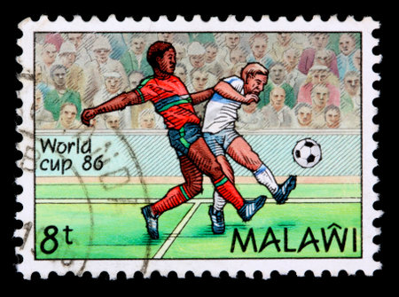 MALAWI -CIRCA 1986: An 8-tambala stamp printed in Malawi shows two soccer players and a ball to commemorate the world cup, circa 1986のeditorial素材