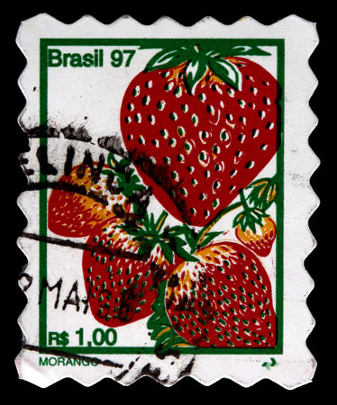 BRAZIL - CIRCA 1997: A 1-real stamp printed in Brazil shows several strawberries (morango), circa 1997のeditorial素材
