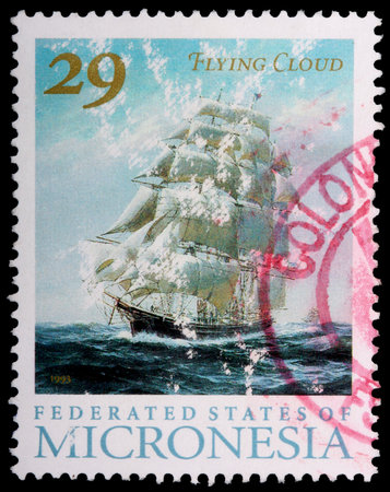 FEDERATED STATES OF MICRONESIA - CIRCA 1993: A tattered 29-cent stamp printed in the Federated States of Micronesia shows the square-rigged sailing ship Flying Cloud, circa 1993のeditorial素材
