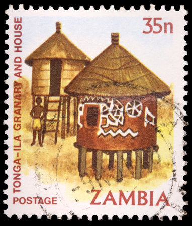 ZAMBIA - CIRCA 1981: A 35-ngwee stamp printed in the Republic of Zambia shows the Tonga-Ila granary and house, circa 1981のeditorial素材