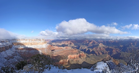 Panorama of the Grand Canyon showing part of the Colorado River basin after an overnight snowfall has dusted the edges of the south rimの写真素材
