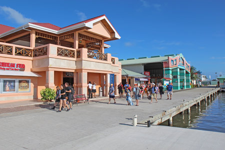 BELIZE CITY - DECEMBER 26: Cruise ship passengers head back to the tenders by the shops at the Belize City Cruise Ship Terminal on the day after Christmas, December 26, 2011. The cruise ship terminal has shops, immigration and access to numerous tours thrのeditorial素材