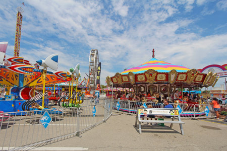 INDIANAPOLIS, INDIANA - AUGUST 12: The carousel and other rides on the Midway at the Indiana State Fair on August 12, 2012. This very popular fair hosts more than 850,000 people every August.のeditorial素材