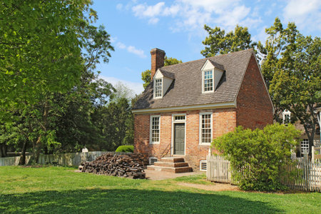 WILLIAMSBURG, VIRGINIA - APRIL 21 2012: A small brick building in the center of Colonial Williamsburg in Virginia. The restored town is a major attraction for tourists and meetings of world leaders.のeditorial素材